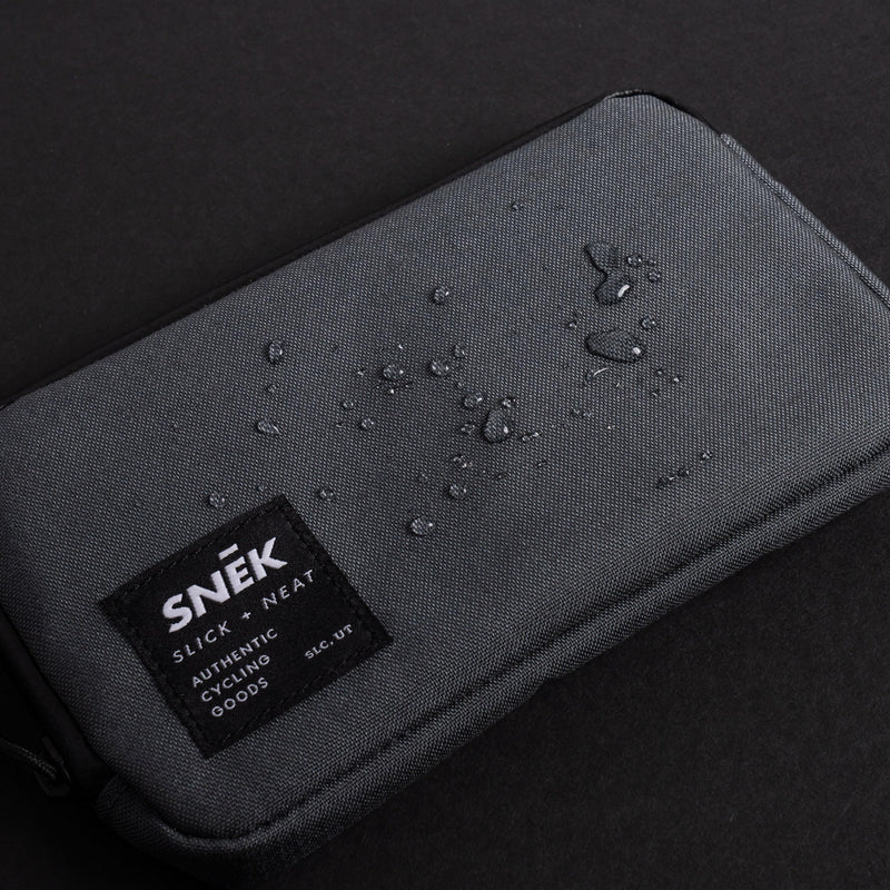 SNEK Wanderer Travel Wallet for Bikes and Travel | Weather Resistant Cordura Organizer Wallet with Zippered Pocket for Phone, Cash, Cards, Passport, Lightweight and Durable | Charcoal