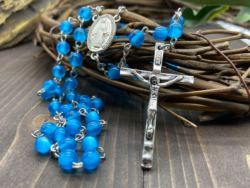 [Australia] - Nazareth Store Rosary Necklace 7mm Round Light Blue Beads Turquoise Cat Eye Stone Miraculous Medal with Crucifix - Velvet Bag 